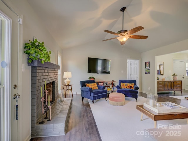 116 Hallett St, Fort Mill, SC 29715 - living area featuring wood finished floors, lofted ceiling, a brick fireplace, and a ceiling fan