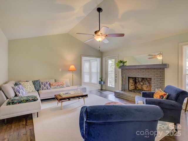 116 Hallett St, Fort Mill, SC 29715 - living area featuring wood finished floors, a ceiling fan, lofted ceiling, and a brick fireplace