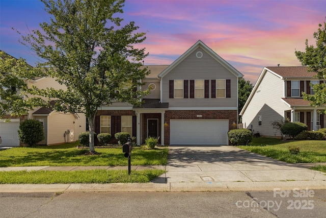 5307 Ayers Orchard Way, Charlotte, NC 28227 - traditional home with driveway, brick siding, a garage, and a front lawn