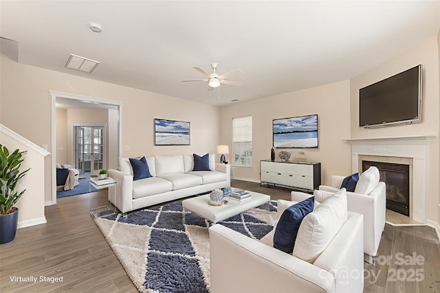 5307 Ayers Orchard Way, Charlotte, NC 28227 - living area with a ceiling fan, wood finished floors, a fireplace, and stairs