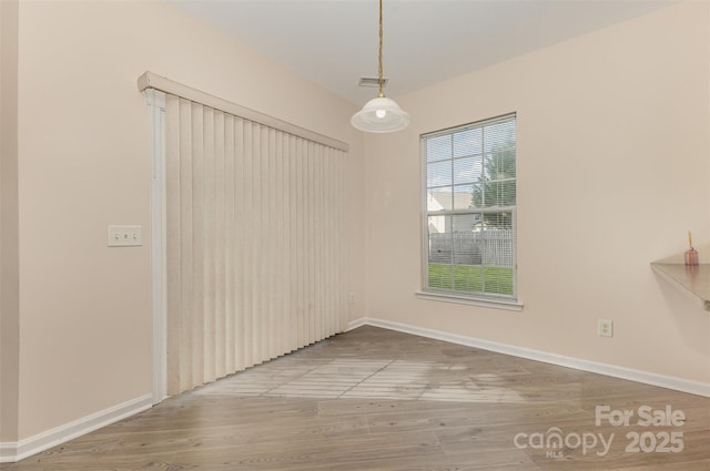 5307 Ayers Orchard Way, Charlotte, NC 28227 - unfurnished dining area featuring wood finished floors and baseboards