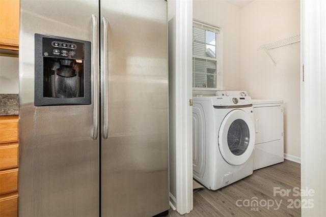 5307 Ayers Orchard Way, Charlotte, NC 28227 - laundry room with washer and dryer and light wood-style floors