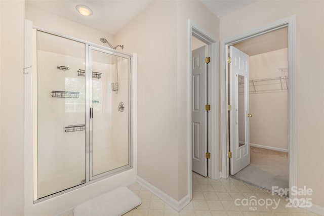 5307 Ayers Orchard Way, Charlotte, NC 28227 - full bathroom with a stall shower, a walk in closet, and tile patterned floors