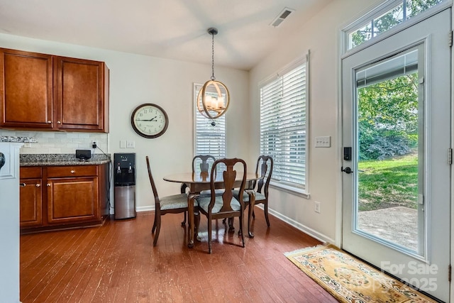 10132 Caldwell Depot Rd, Cornelius, NC 28031 - dining room with dark wood finished floors, healthy amount of natural light, and a chandelier