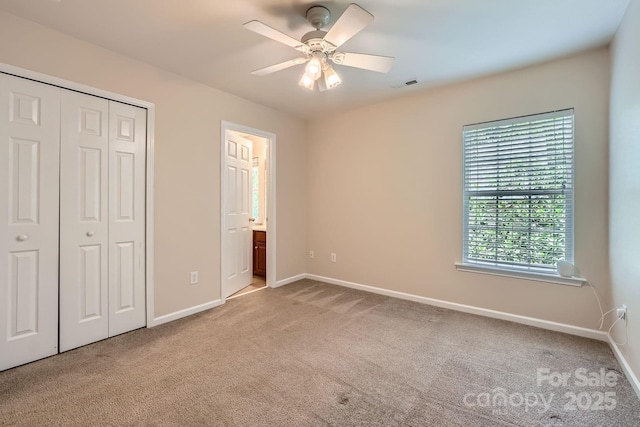 10132 Caldwell Depot Rd, Cornelius, NC 28031 - unfurnished bedroom featuring carpet flooring, a closet, ensuite bath, and a ceiling fan