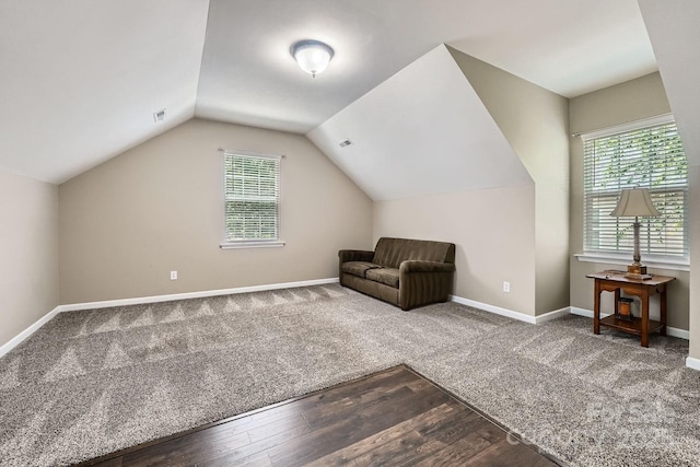 10132 Caldwell Depot Rd, Cornelius, NC 28031 - unfurnished room with wood finished floors, lofted ceiling, and carpet