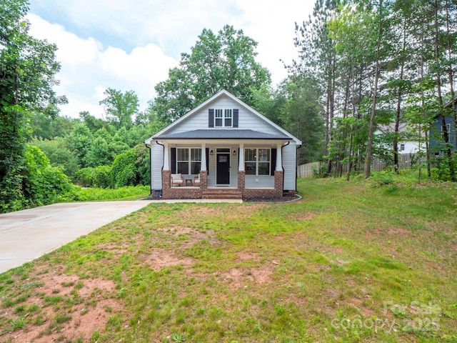 720 4th St, Stanley, NC 28164 - view of front of property with a porch, brick siding, and driveway