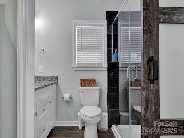720 4th St, Stanley, NC 28164 - full bathroom featuring vanity, a stall shower, and wood finished floors