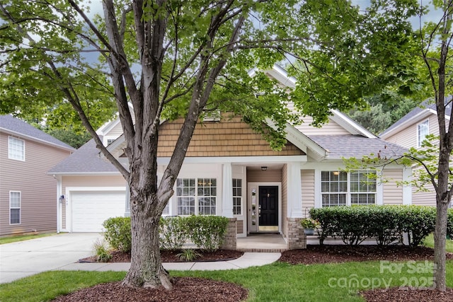 1040 Stonedown Ln, Matthews, NC 28104 - view of front of house with a garage, driveway, a shingled roof, and a porch