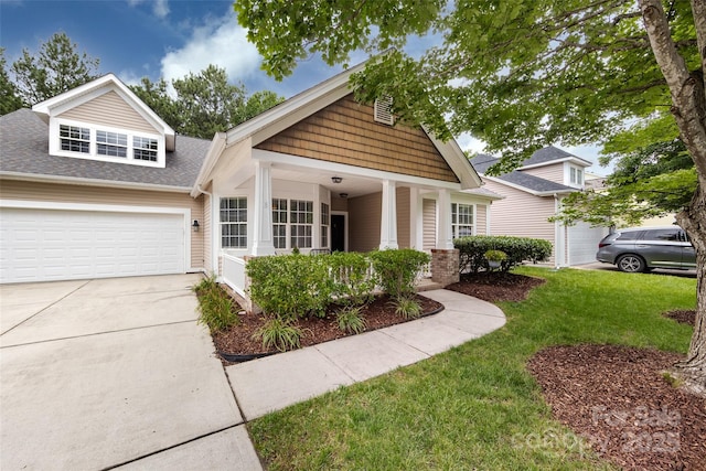 1040 Stonedown Ln, Matthews, NC 28104 - craftsman house featuring a front yard, concrete driveway, roof with shingles, a porch, and a garage