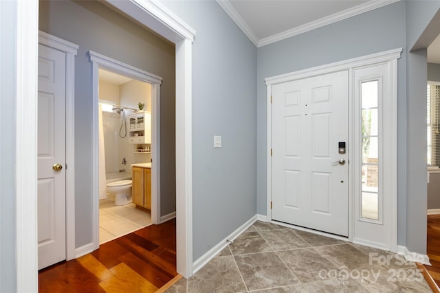 1040 Stonedown Ln, Matthews, NC 28104 - tiled entryway featuring crown molding and baseboards