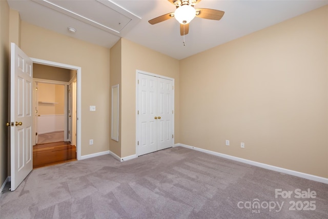 1040 Stonedown Ln, Matthews, NC 28104 - unfurnished bedroom featuring attic access, carpet flooring, a closet, and a ceiling fan