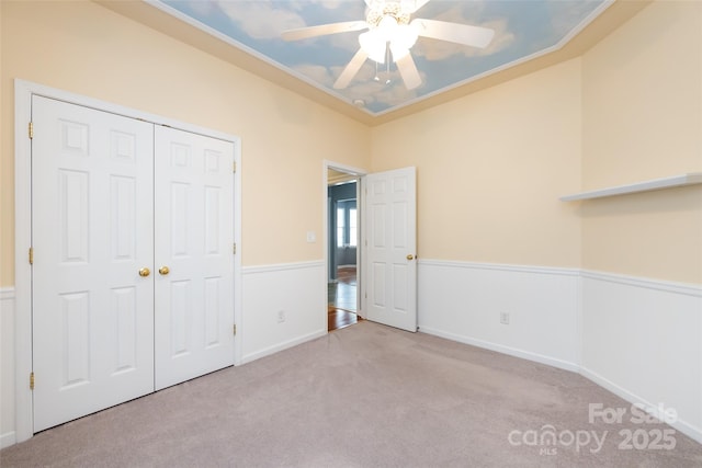 1040 Stonedown Ln, Matthews, NC 28104 - unfurnished bedroom featuring carpet flooring, a closet, a ceiling fan, and ornamental molding