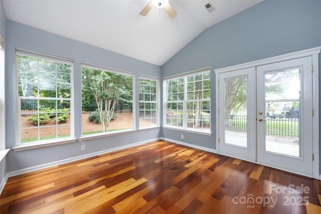 1040 Stonedown Ln, Matthews, NC 28104 - unfurnished sunroom featuring french doors, plenty of natural light, vaulted ceiling, and hardwood / wood-style flooring