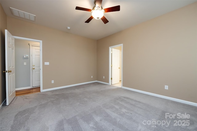 1040 Stonedown Ln, Matthews, NC 28104 - carpeted spare room featuring a ceiling fan and baseboards