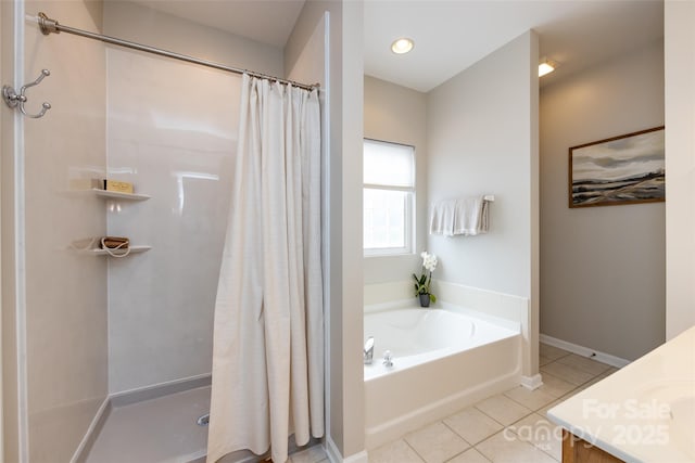 1040 Stonedown Ln, Matthews, NC 28104 - full bathroom with tile patterned floors, a shower stall, a bath, and vanity