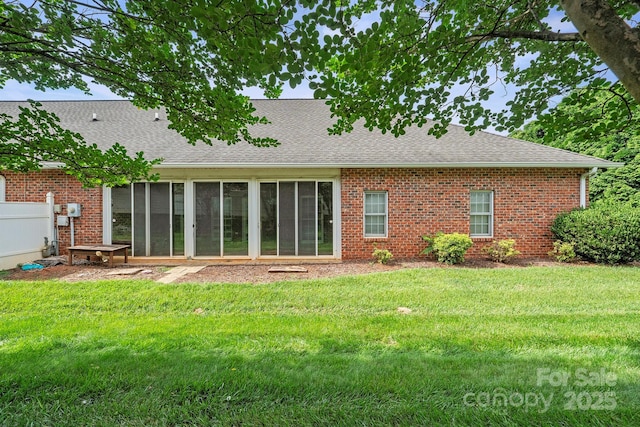 104 Mooreland Dr NE, Conover, NC 28613 - back of house with roof with shingles, a sunroom, and brick siding