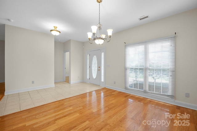 104 Mooreland Dr NE, Conover, NC 28613 - foyer featuring a chandelier and wood finished floors