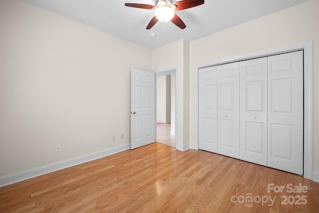 104 Mooreland Dr NE, Conover, NC 28613 - unfurnished bedroom with light wood finished floors, a closet, and ceiling fan