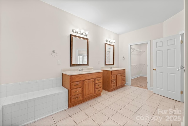 104 Mooreland Dr NE, Conover, NC 28613 - full bathroom featuring vanity, tile patterned floors, and a spacious closet