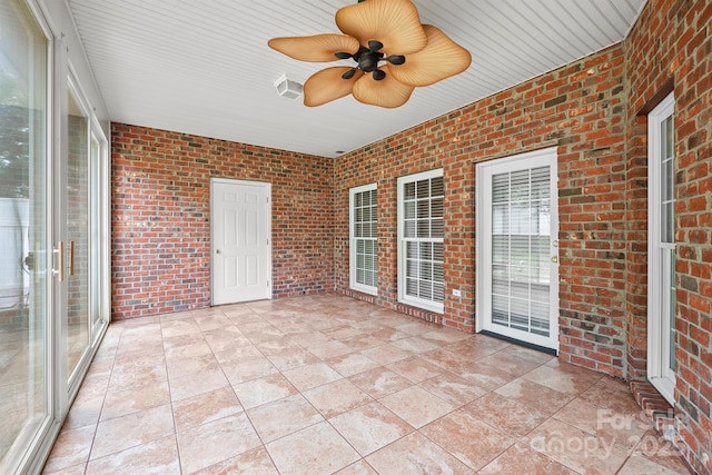 104 Mooreland Dr NE, Conover, NC 28613 - unfurnished sunroom featuring a ceiling fan