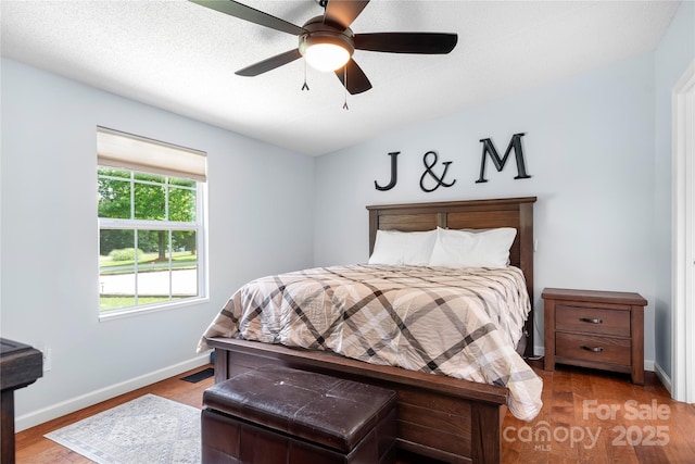 1489 L R Schronce Ln, Iron Station, NC 28080 - bedroom with wood finished floors and ceiling fan