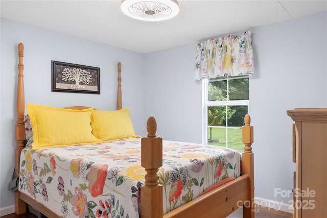 1489 L R Schronce Ln, Iron Station, NC 28080 - bedroom featuring baseboards and wood finished floors