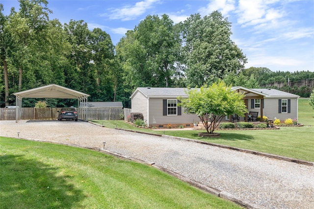 1489 L R Schronce Ln, Iron Station, NC 28080 - view of front of home featuring driveway, a detached carport, and crawl space