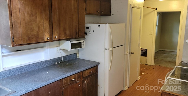 7705 Stone Canyon Ln, Charlotte, NC 28227 - kitchen with freestanding refrigerator and light wood finished floors