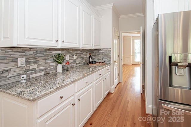 2019 Heirloom Ct, Matthews, NC 28104 - kitchen with stainless steel fridge with ice dispenser, light wood-style floors, crown molding, backsplash, and white cabinetry