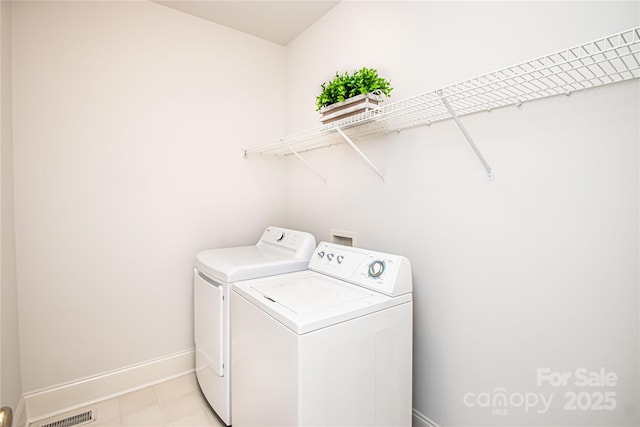 2019 Heirloom Ct, Matthews, NC 28104 - laundry room with washing machine and dryer and baseboards