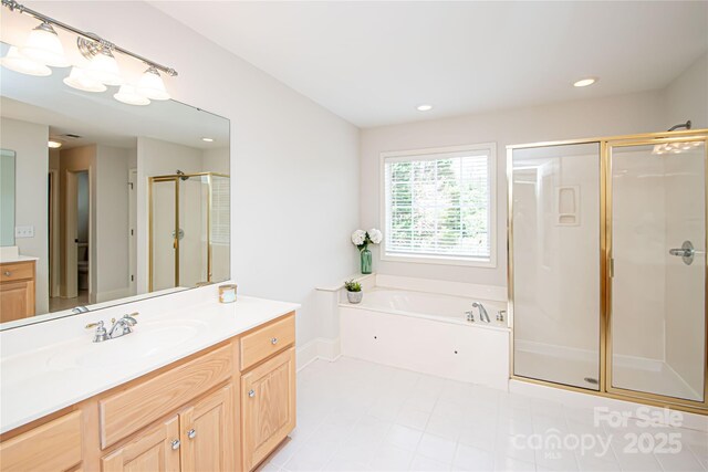 2019 Heirloom Ct, Matthews, NC 28104 - full bath featuring a stall shower, vanity, a garden tub, recessed lighting, and tile patterned flooring
