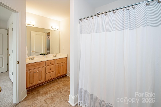 2019 Heirloom Ct, Matthews, NC 28104 - bathroom with double vanity and a shower with shower curtain