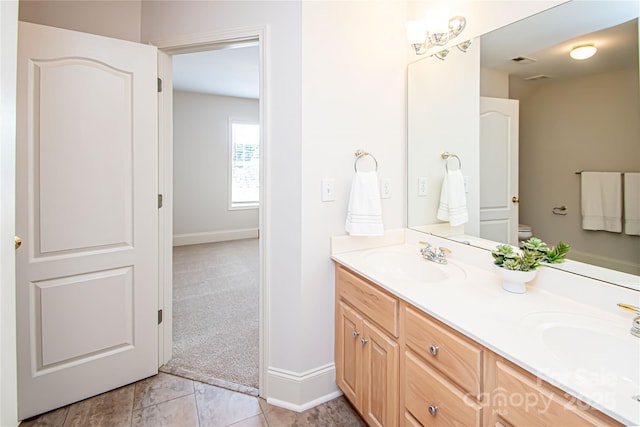 2019 Heirloom Ct, Matthews, NC 28104 - bathroom featuring double vanity and baseboards