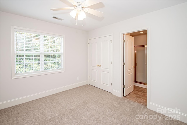 2019 Heirloom Ct, Matthews, NC 28104 - unfurnished bedroom featuring light carpet, a closet, and ceiling fan
