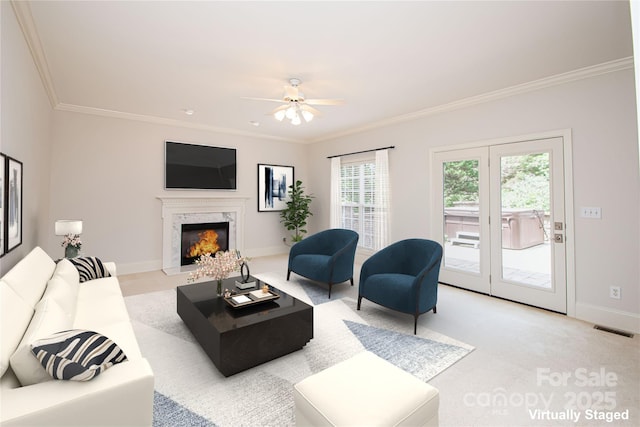 2019 Heirloom Ct, Matthews, NC 28104 - living area with crown molding, a fireplace, a ceiling fan, and light colored carpet