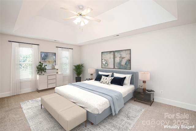 2019 Heirloom Ct, Matthews, NC 28104 - bedroom with a tray ceiling, light carpet, and a ceiling fan