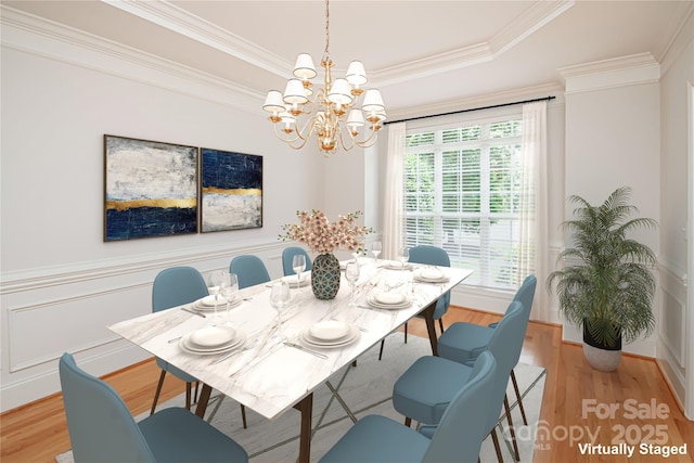 2019 Heirloom Ct, Matthews, NC 28104 - dining space with a chandelier, light wood finished floors, crown molding, and a raised ceiling