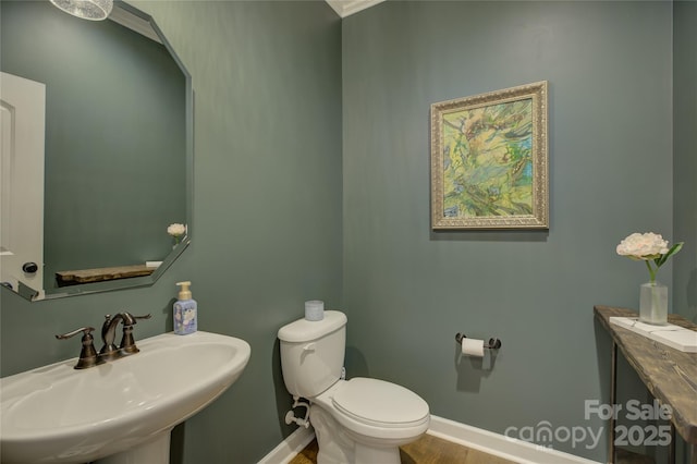 17537 Caddy Ct, Charlotte, NC 28278 - half bathroom featuring a sink and wood finished floors
