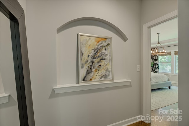 17537 Caddy Ct, Charlotte, NC 28278 - hall with wood finished floors and a chandelier