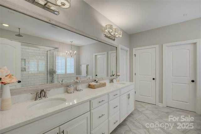 17537 Caddy Ct, Charlotte, NC 28278 - full bath with double vanity, a stall shower, and a chandelier