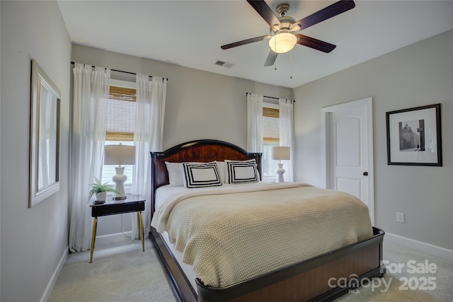 17537 Caddy Ct, Charlotte, NC 28278 - bedroom with light colored carpet, multiple windows, and a ceiling fan
