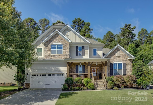 17537 Caddy Ct, Charlotte, NC 28278 - craftsman house with board and batten siding, stone siding, a porch, and a garage