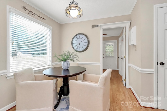 3304 Chilham Pl, Charlotte, NC 28226 - dining area with light wood finished floors and ornamental molding