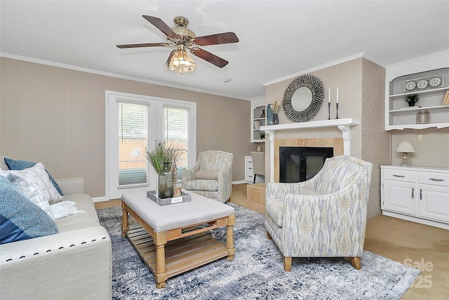3304 Chilham Pl, Charlotte, NC 28226 - living room with a ceiling fan, ornamental molding, and a tiled fireplace
