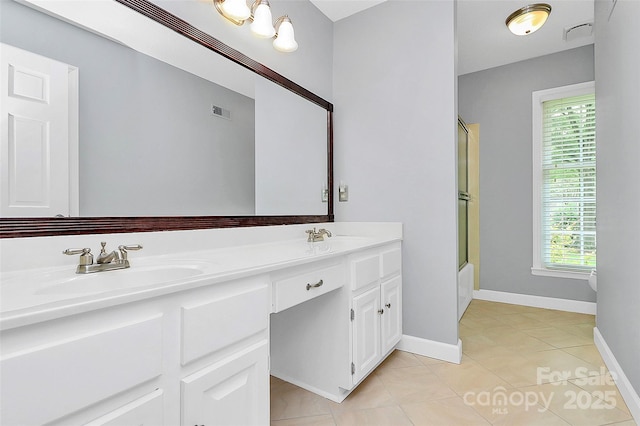 3304 Chilham Pl, Charlotte, NC 28226 - full bath with double vanity, tile patterned floors, and enclosed tub / shower combo