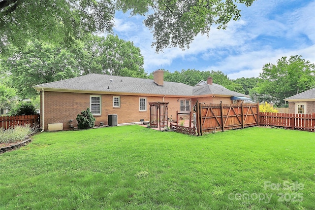 3304 Chilham Pl, Charlotte, NC 28226 - back of house with a chimney, a fenced backyard, and brick siding