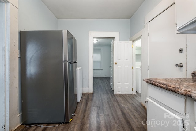4510 Wildwood Ave, Charlotte, NC 28208 - kitchen featuring freestanding refrigerator, dark wood-type flooring, and white cabinetry