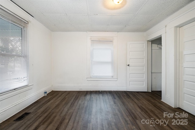 4510 Wildwood Ave, Charlotte, NC 28208 - unfurnished bedroom with dark wood-style floors and a drop ceiling