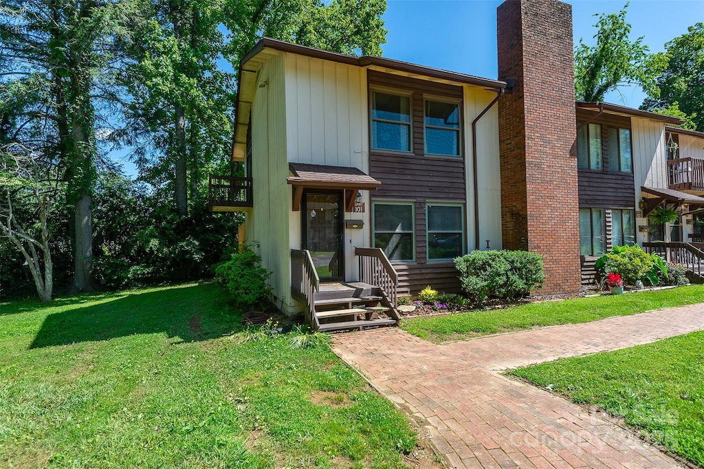 37 Shepard Sq Unit 101, Brevard, NC 28712 - view of property with a front yard and a chimney
